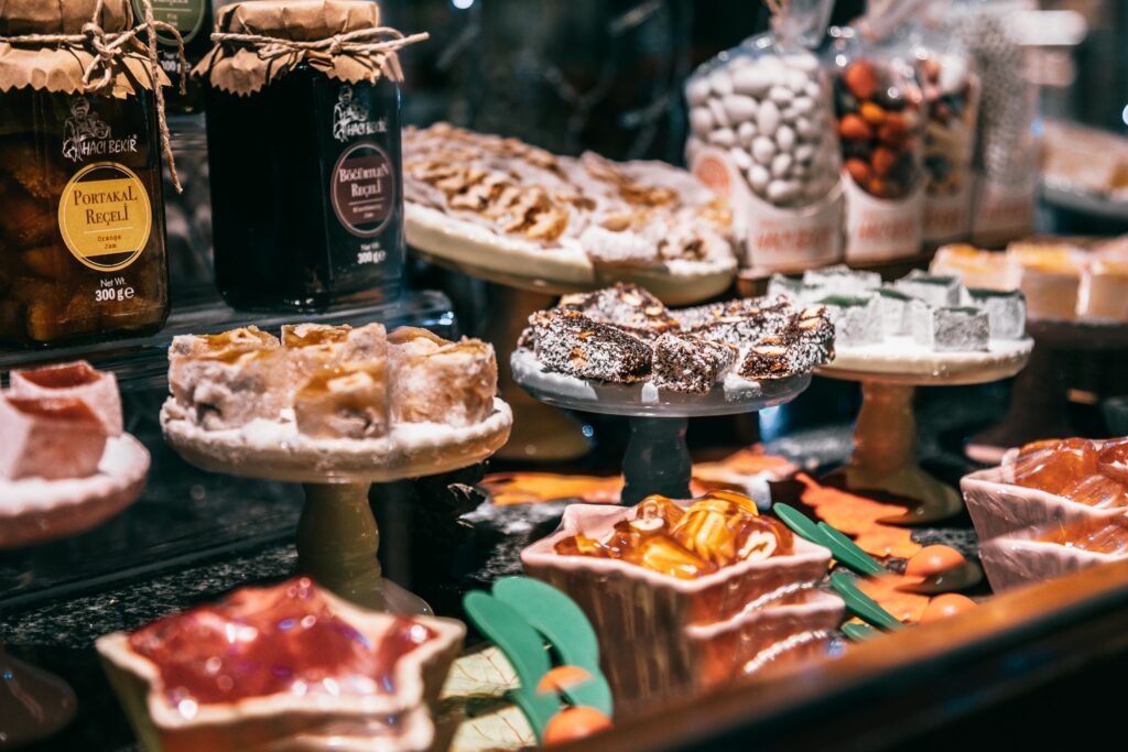Assorted Turkish delights and jam on showcase of market selling delicious traditional sweets