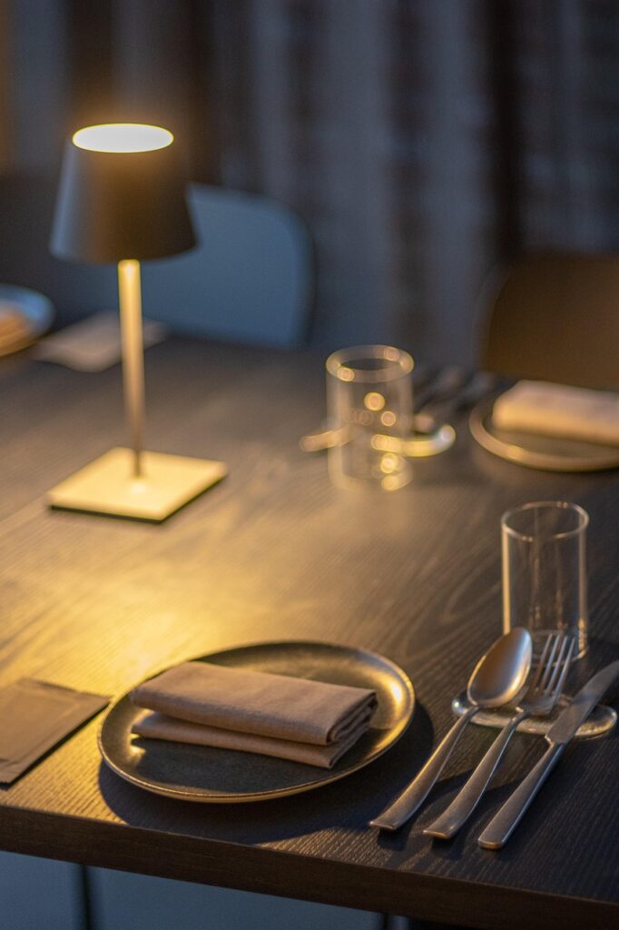 dining table, chair, dining, restaurant, spoon, bowl, light, glass